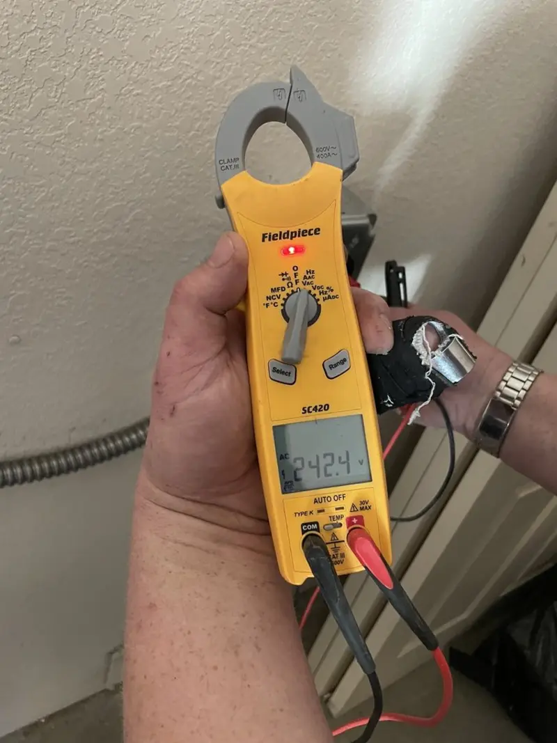 Voltage testing with clamp meter during Circuit Breaker Repair in Centreville